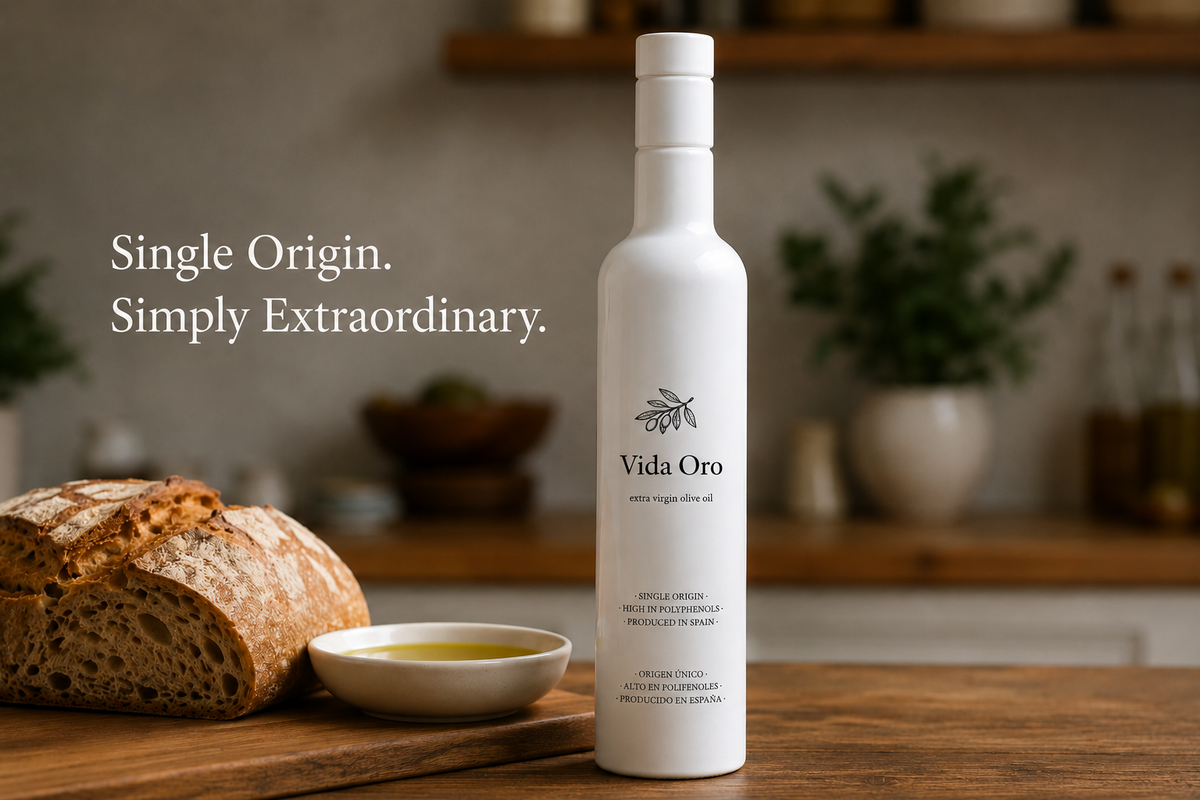 Vida Oro EVOO bottle with bread and olive oil on wooden table